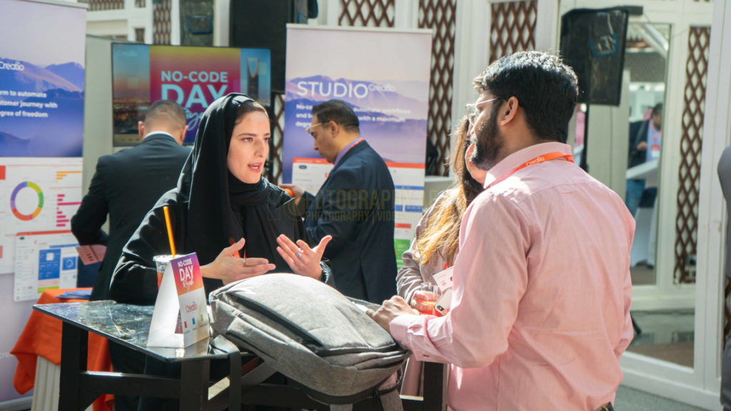 Professional picture of people talking at a conference