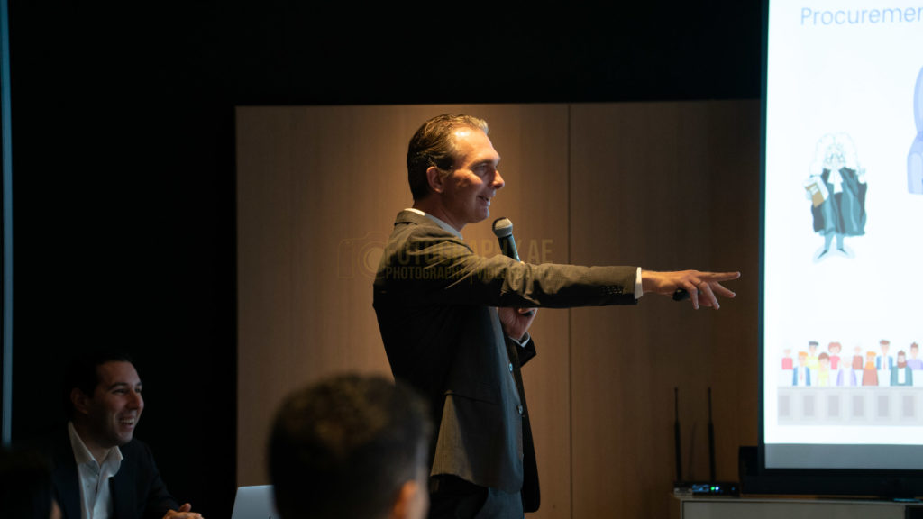 Professional image of a Speaker delivering a speech at a conference in dubai