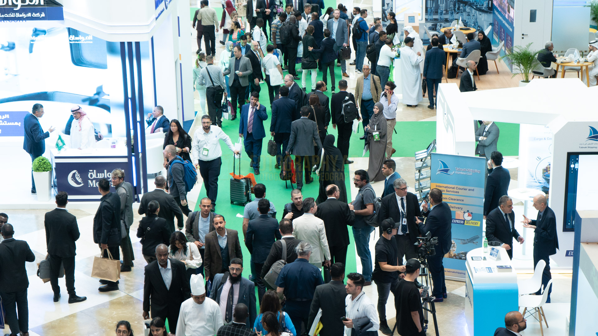 professional photograph of people walking in dubai word trade center during an exhibition