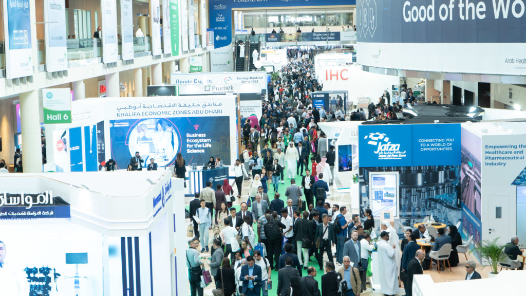 professional photograph of people walking in dubai word trade center during an exhibition