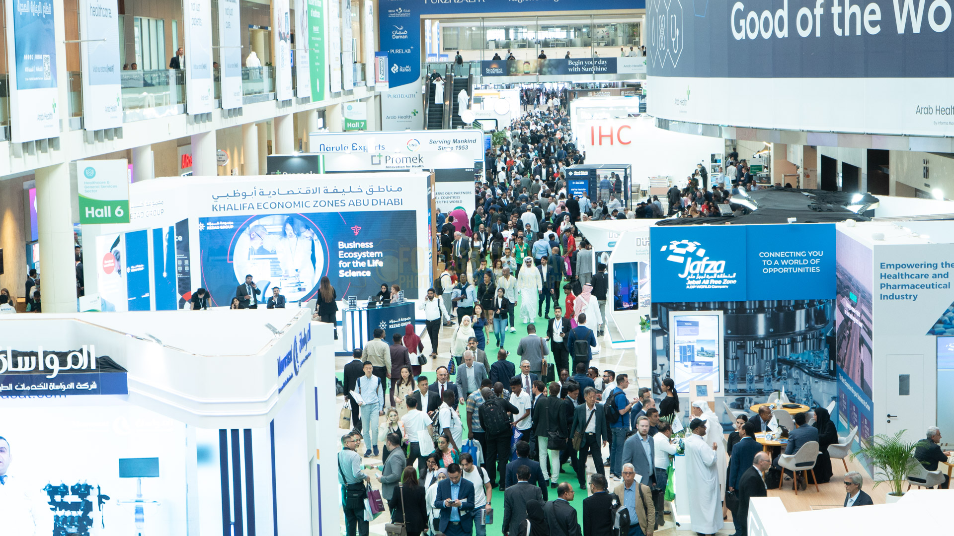 professional photograph of people walking in dubai word trade center during an exhibition